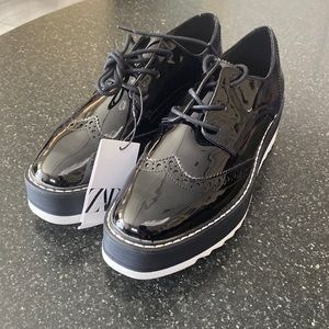 Platform Zara loafers with shoelaces. It is size 7 1/2.